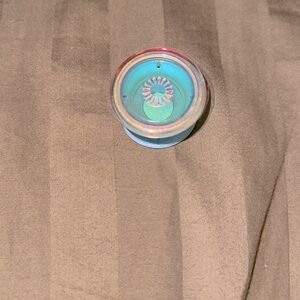 Iridescent pop socket with unused base.